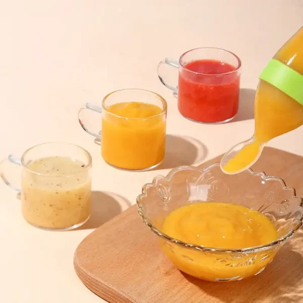 A variety of baby feeding bottles with spoons, in different colors and sizes