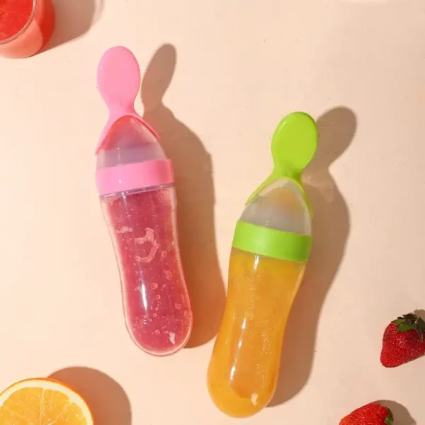 A variety of baby feeding bottles with spoons, in different colors and sizes