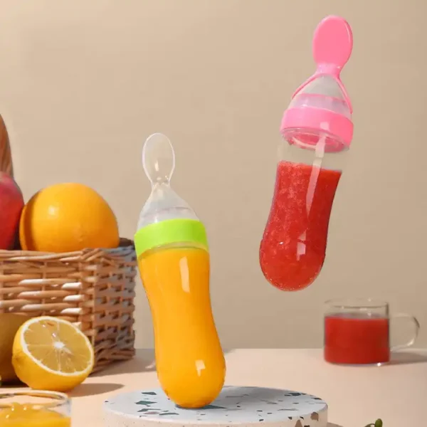 A variety of baby feeding bottles with spoons, in different colors and sizes